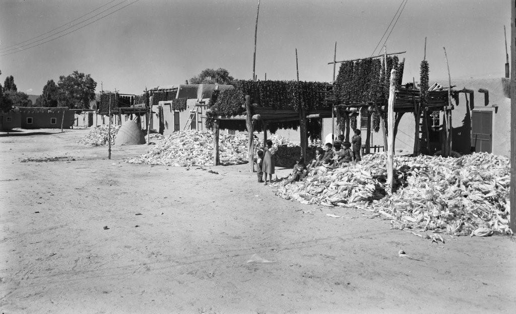 Corn harvest and processing in the village at Pueblo de San Ildefonso around the 1930s.